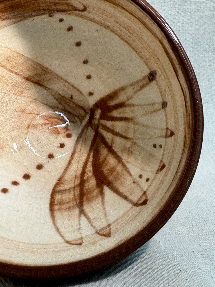 Handmade ceramic bowl with abstract painted design