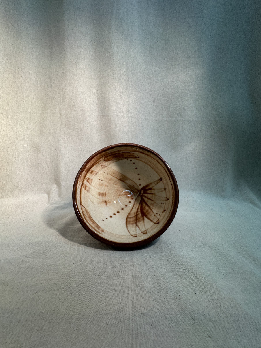 Handmade ceramic bowl with abstract painted design