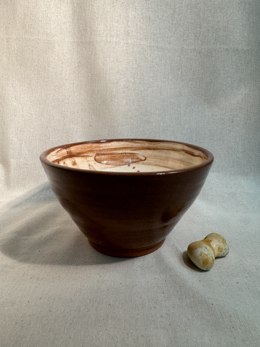 Handmade ceramic bowl with abstract painted design