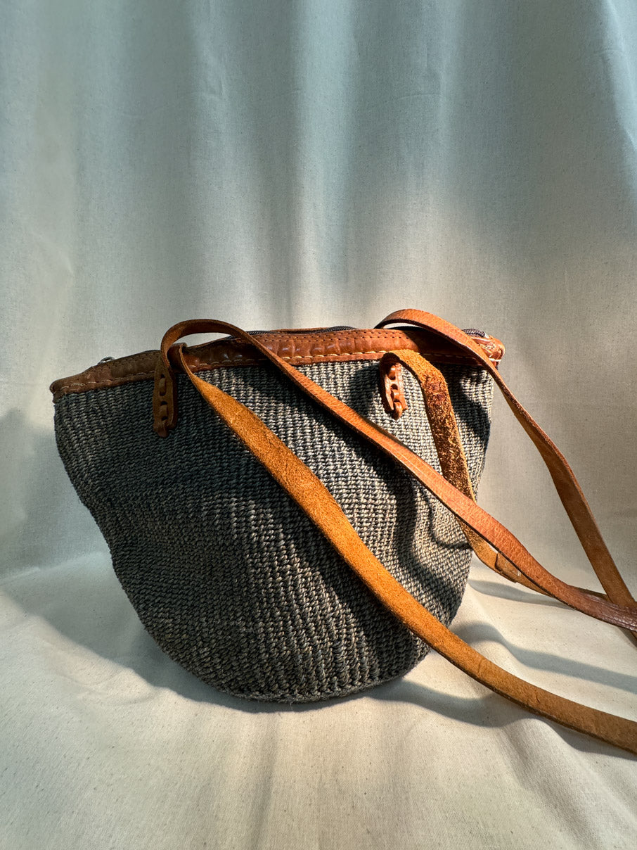 Woven bag with leather handle