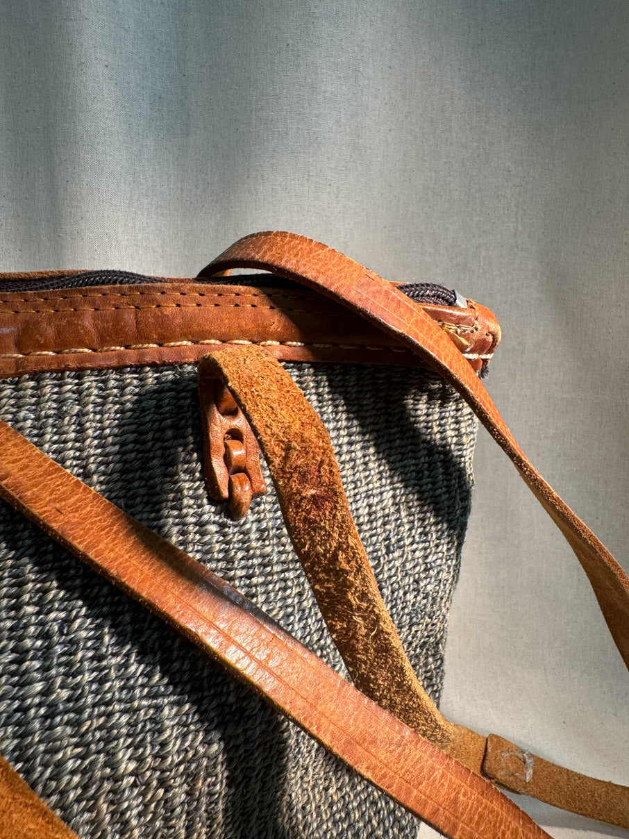 Woven bag with leather handle