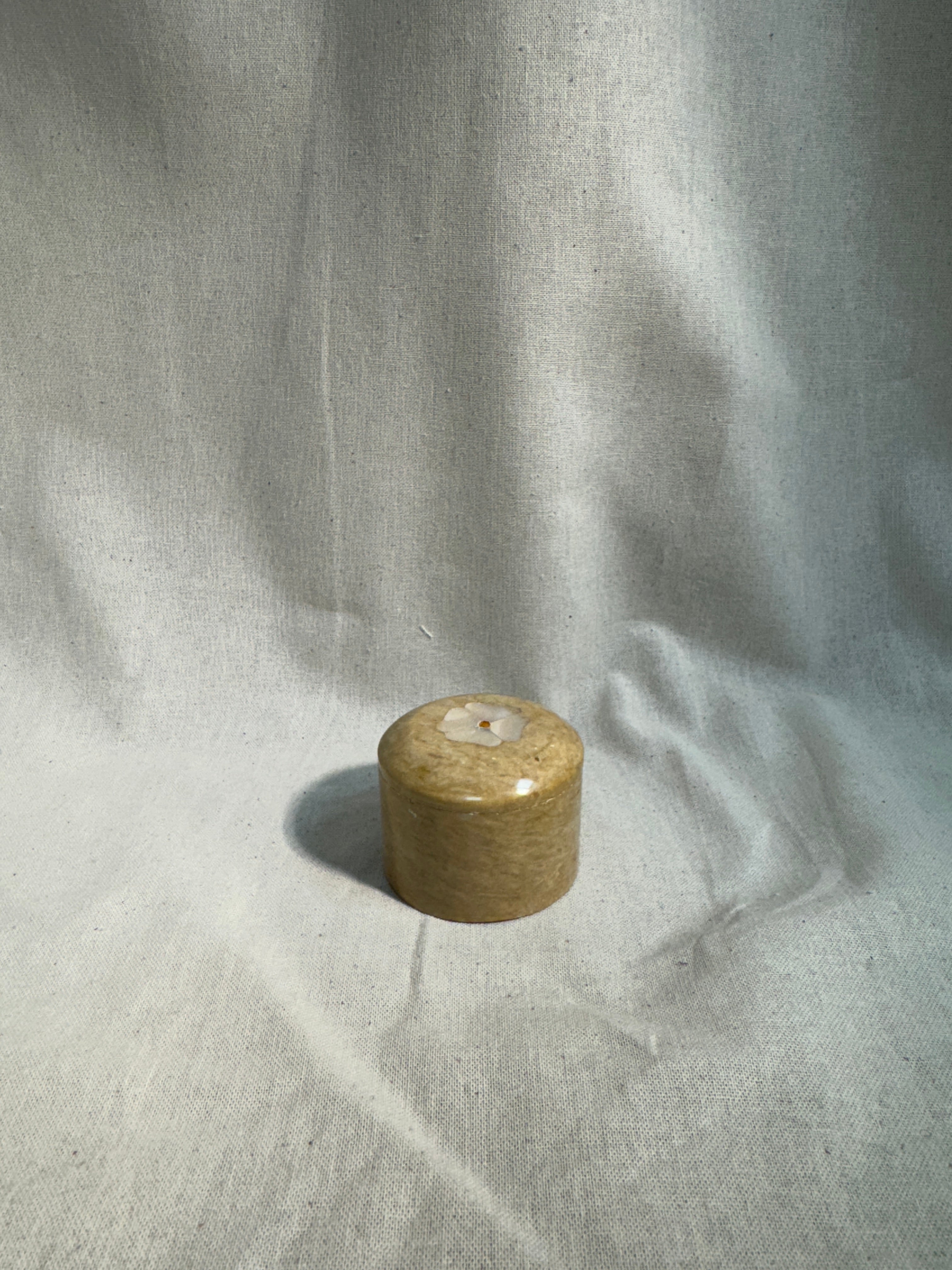 Stone pill box with flower inlay