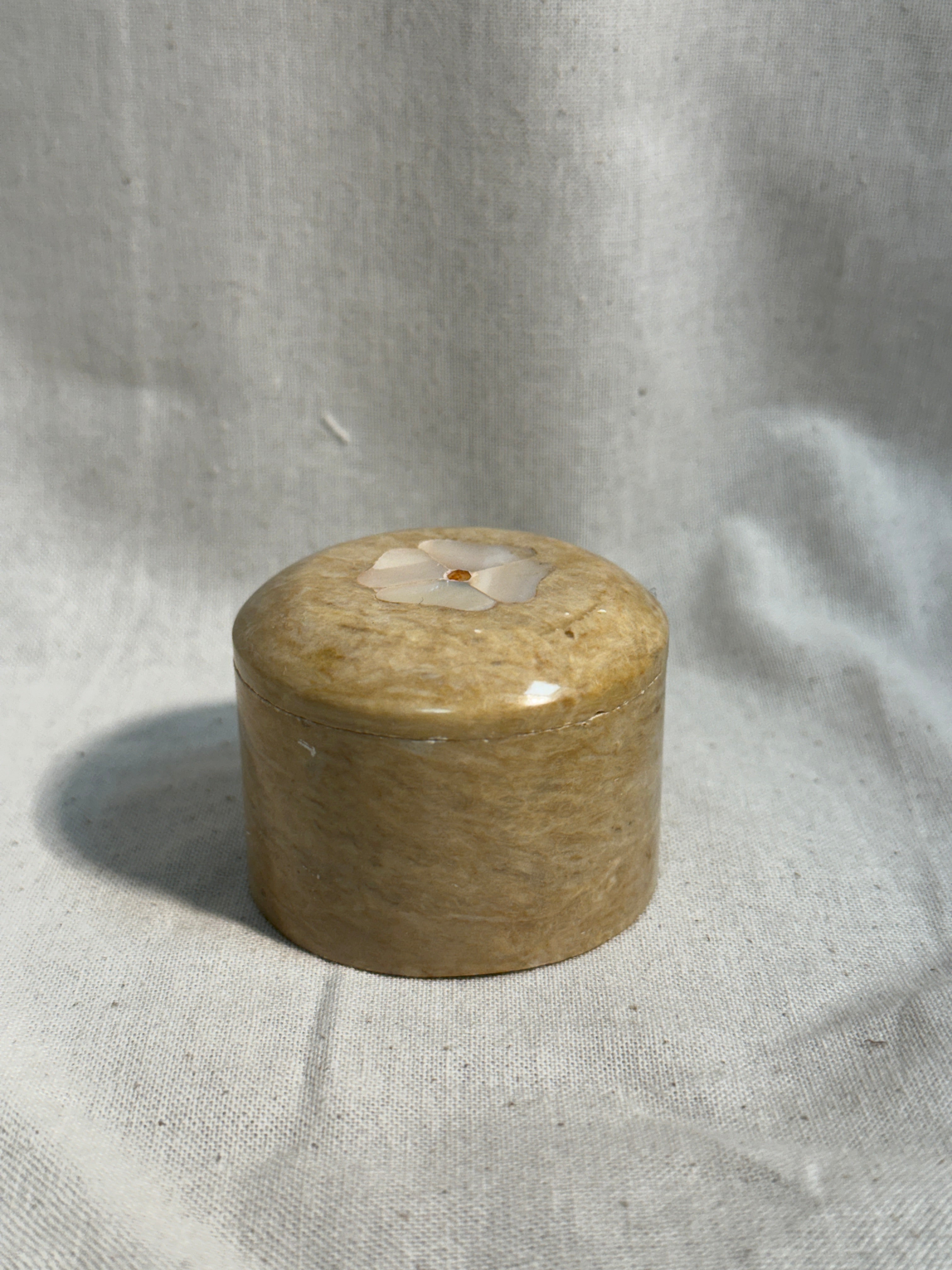 Stone pill box with flower inlay