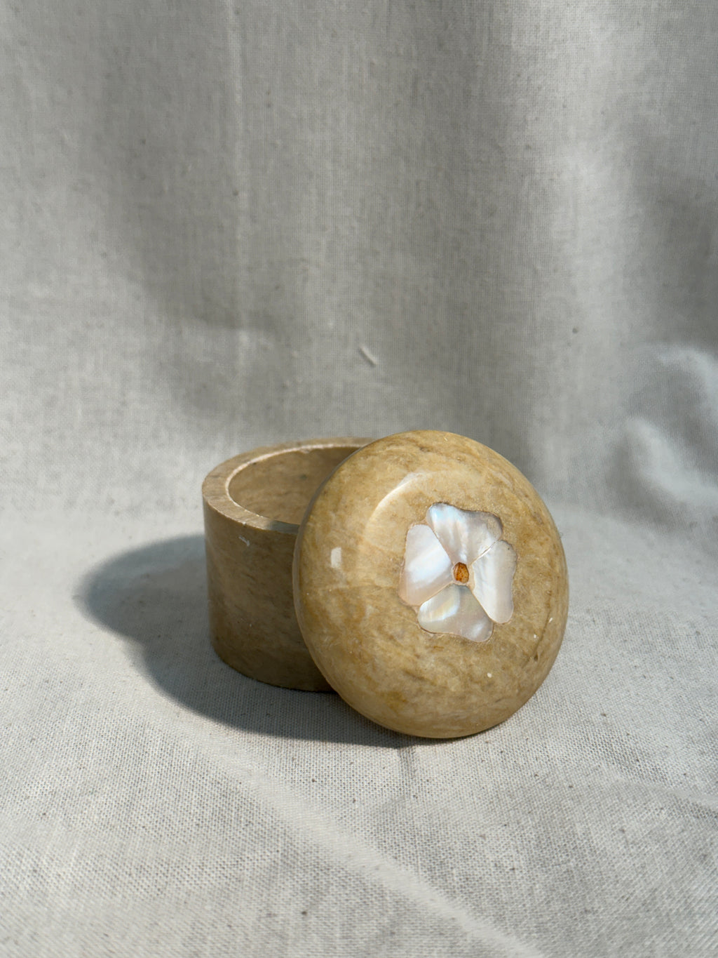 Stone pill box with flower inlay